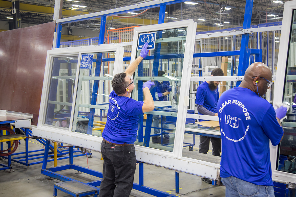 PGT team members assemble vinyl windows