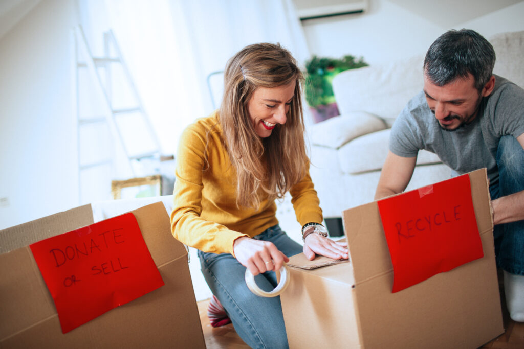 couple organizing home, donating items